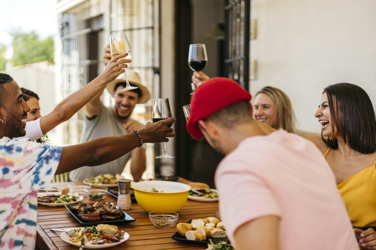 group-of-friends-toasting-while-eating-a-barbeque.jpg