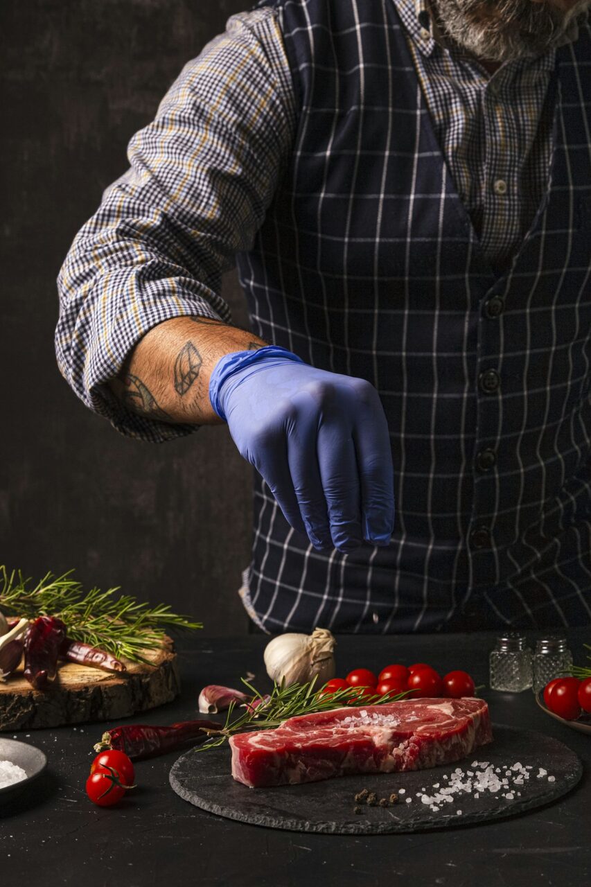 the-chef-brushes-salt-over-the-ready-to-grill-beef-entrecote.jpg